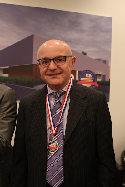 Dr. Moise Khayrallah wearing the honorary House of Lebanon medal.